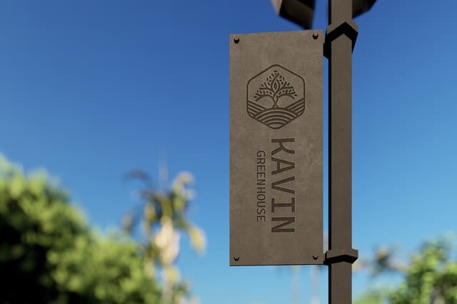 Modern entrance pylon sign with directional arrows.