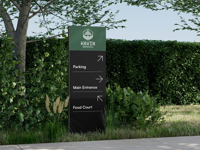 Directional wayfinding totem in a natural landscape setting.